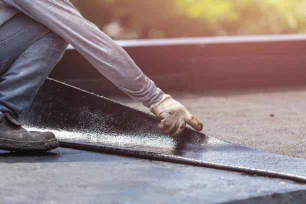Professional Basement Waterproofing technician working in Hamilton, IL